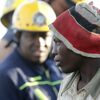 
                                            A suspected illegal miner is led away after being rescued from an abandoned gold shaft in Benoni, east of Johannesburg, February 16, 2014. REUTERS/Mike Hutchings