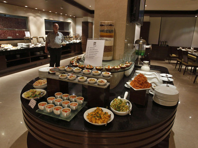 A guest walks inside a restaurant of the Four Points hotel in the western Indian city of Ahmedabad