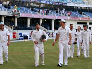 Jacques Kallis, wicketkeeper AB de Villiers and captain Graeme Smith of South Africa walk out of the grounds with their team after winning the second test cricket match against Pakistan in Dubai on October 26, 2013