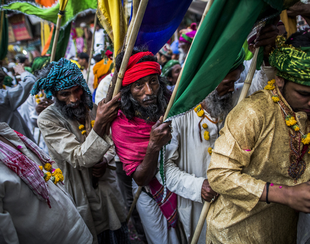 Sufi Muslim pilgrims carry flags as they march towards the 'durgah' or shrine, where Muhammad Moin-ud-din Chisti is buried, during the annual 'Urs' procession.